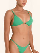 Chic green swimwear top with minimal design and sleek fit.