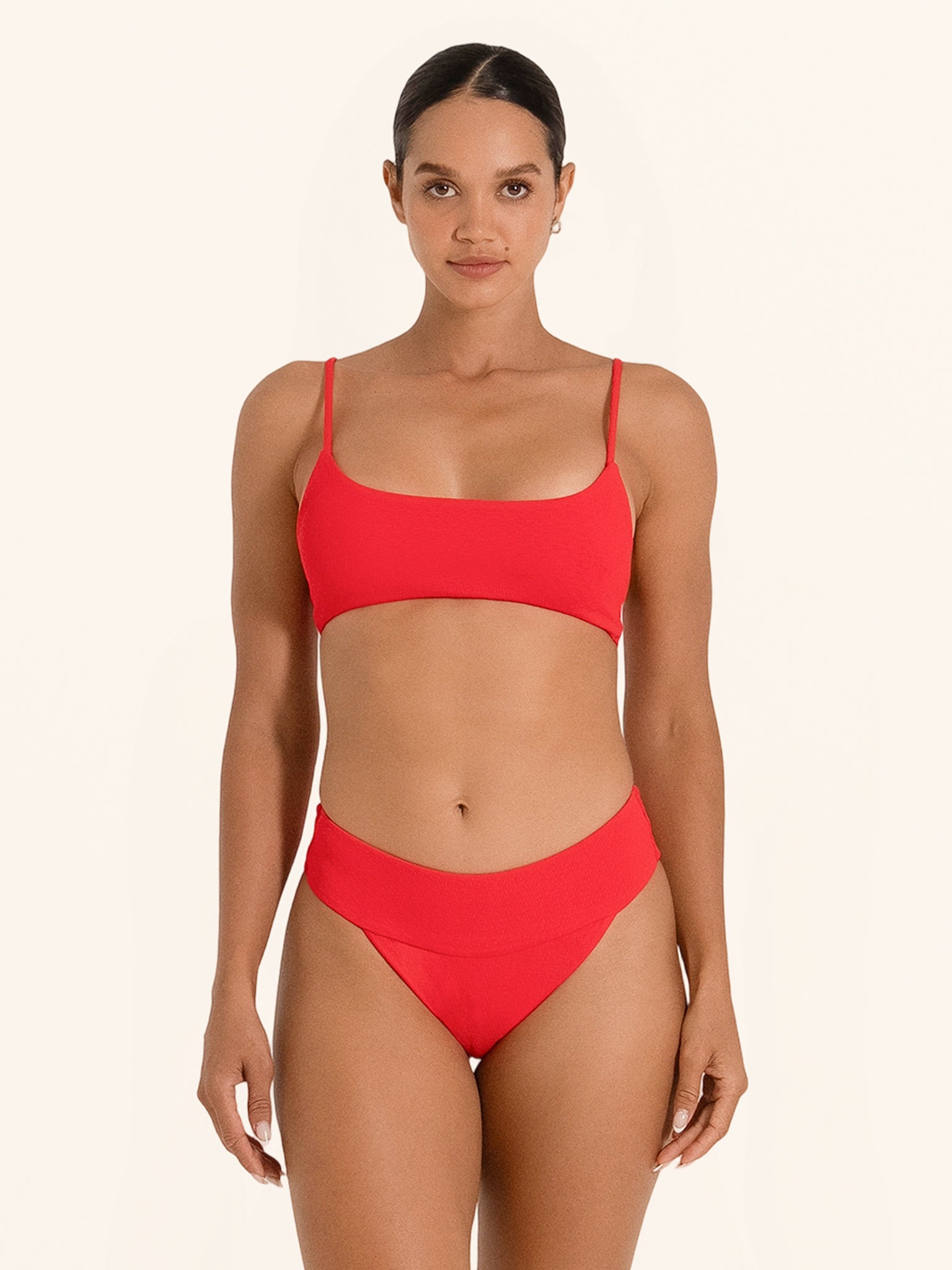 Chic red bikini top with simple modern fit.