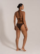 Rear angle of chocolate triangle bikini set featuring adjustable halter straps and side ties