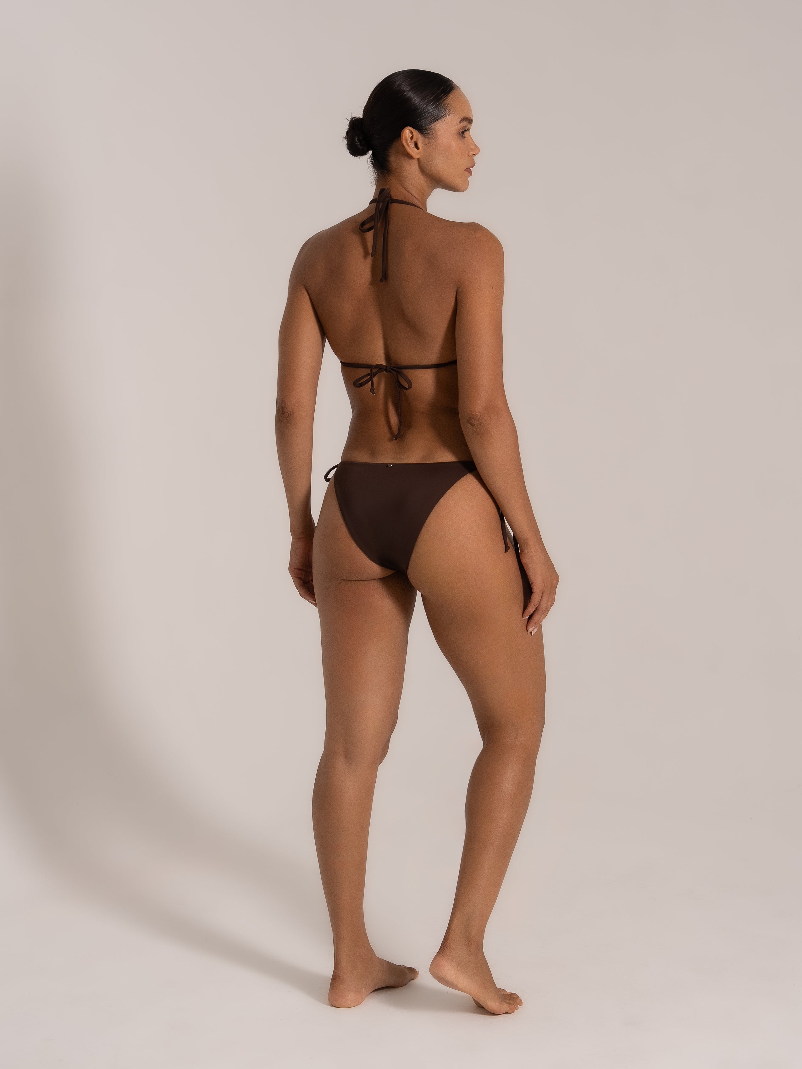 Rear angle of chocolate triangle bikini set featuring adjustable halter straps and side ties