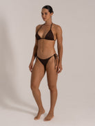 Side angle of chocolate halter neck bikini set with flattering triangle cups and tie side bottoms