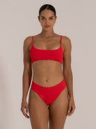 Full body shot showcasing red bikini top with flattering scoop neckline