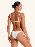 Classic white string bikini bottom with tie sides and minimal coverage.