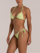 Angled view of side-tie lime textured bikini swimwear