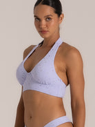Side angle of lavender floral eyelet halter bikini top with soft molded cups
