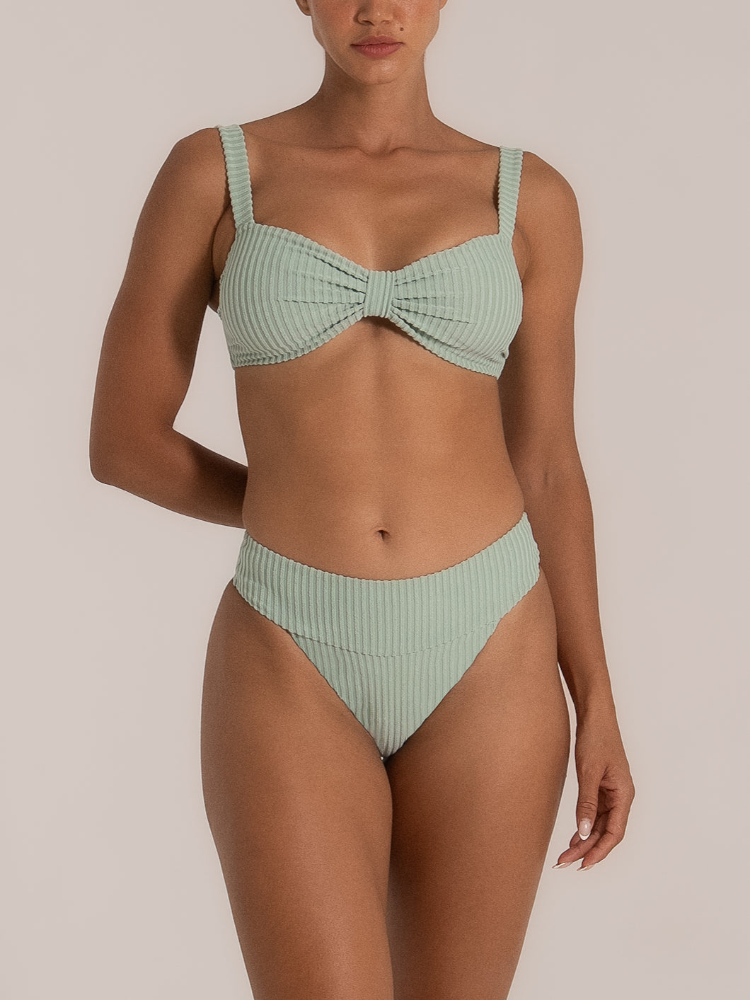 Front view of high waisted mint bikini bottom with ribbed texture and wide waistband