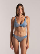 Front view of woman wearing blue textured bikini set