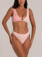 Full front view of pink high waist bikini bottom set with wide straps and ring accent