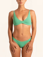 Front view of green textured bikini bottom in a classic swimwear cut.