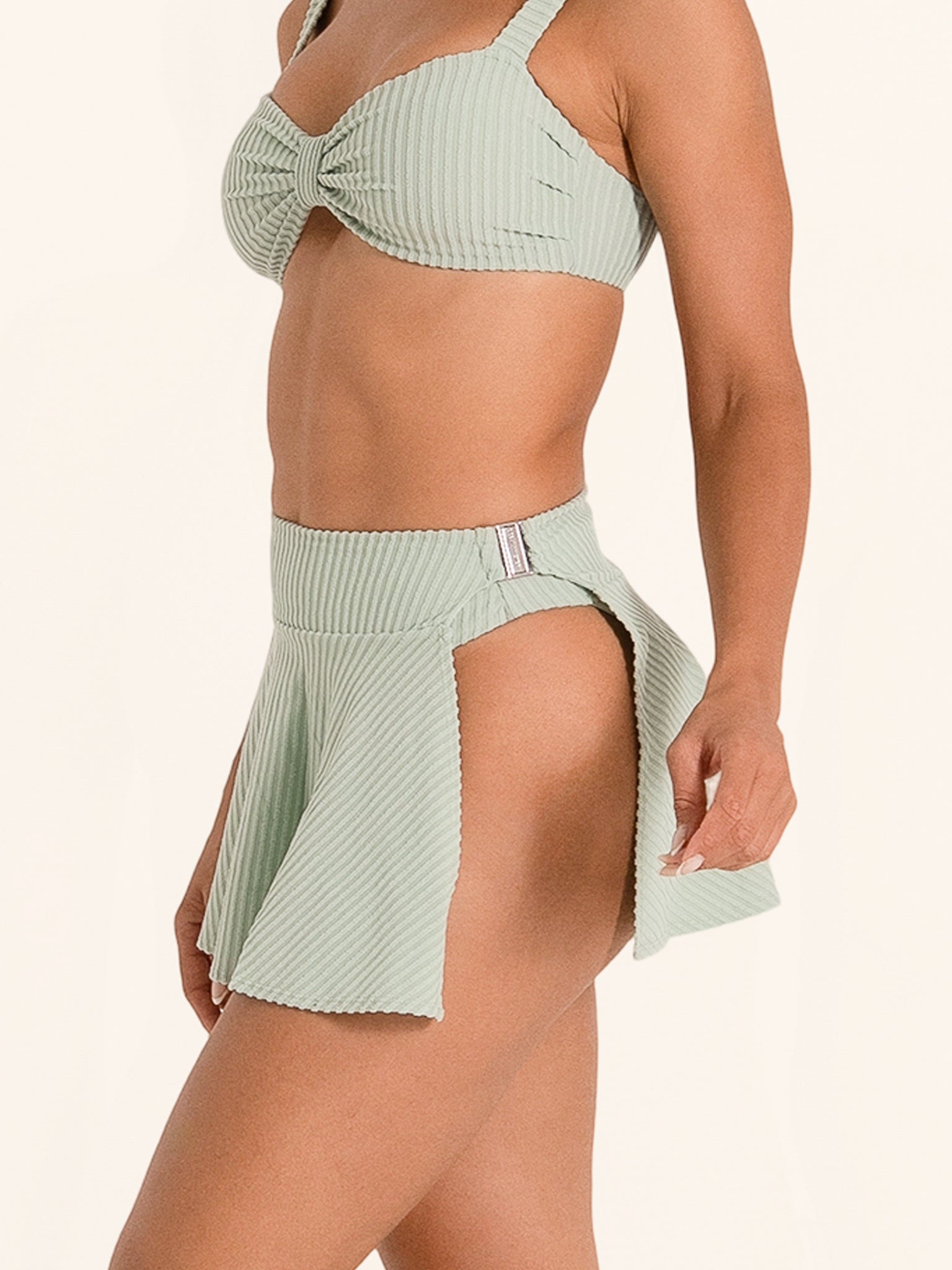 Green high waist bikini skirt bottom with flared hem.