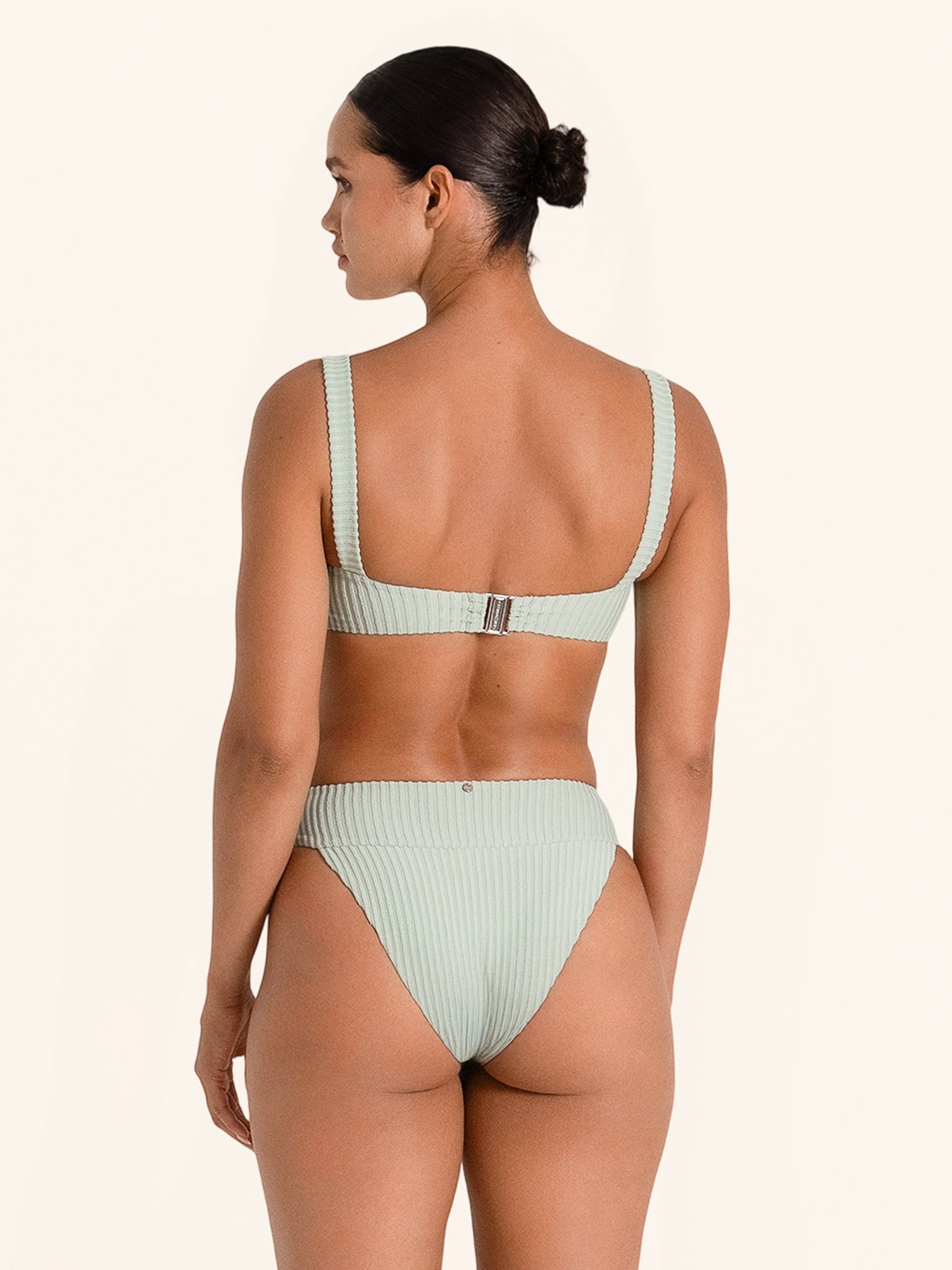 Green swimwear bottom in high rise style with ribbed detail.