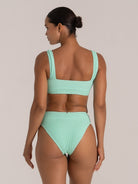 Back view of green textured bikini top with wide straps