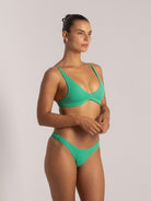 Side front view of green textured V-neck bikini set with flattering shape and thin straps