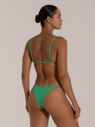 Back view of green triangle bikini top with adjustable straps and minimal clasp closure.