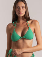 Front close-up of textured green bikini top with classic triangle silhouette