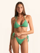 Front view of green halter triangle bikini top with tie straps and minimal coverage.