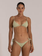 Model wearing green ribbed triangle bikini top with tie back and flattering shape