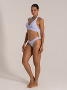 Side view of lilac floral bikini set with halter strap and sculpted bra cups
