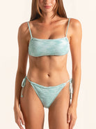 Front view of ice blue tie side bikini bottom with low rise fit and cheeky coverage.