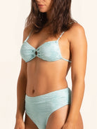 Side profile of ice blue bikini bottom in flattering high-waist cut.