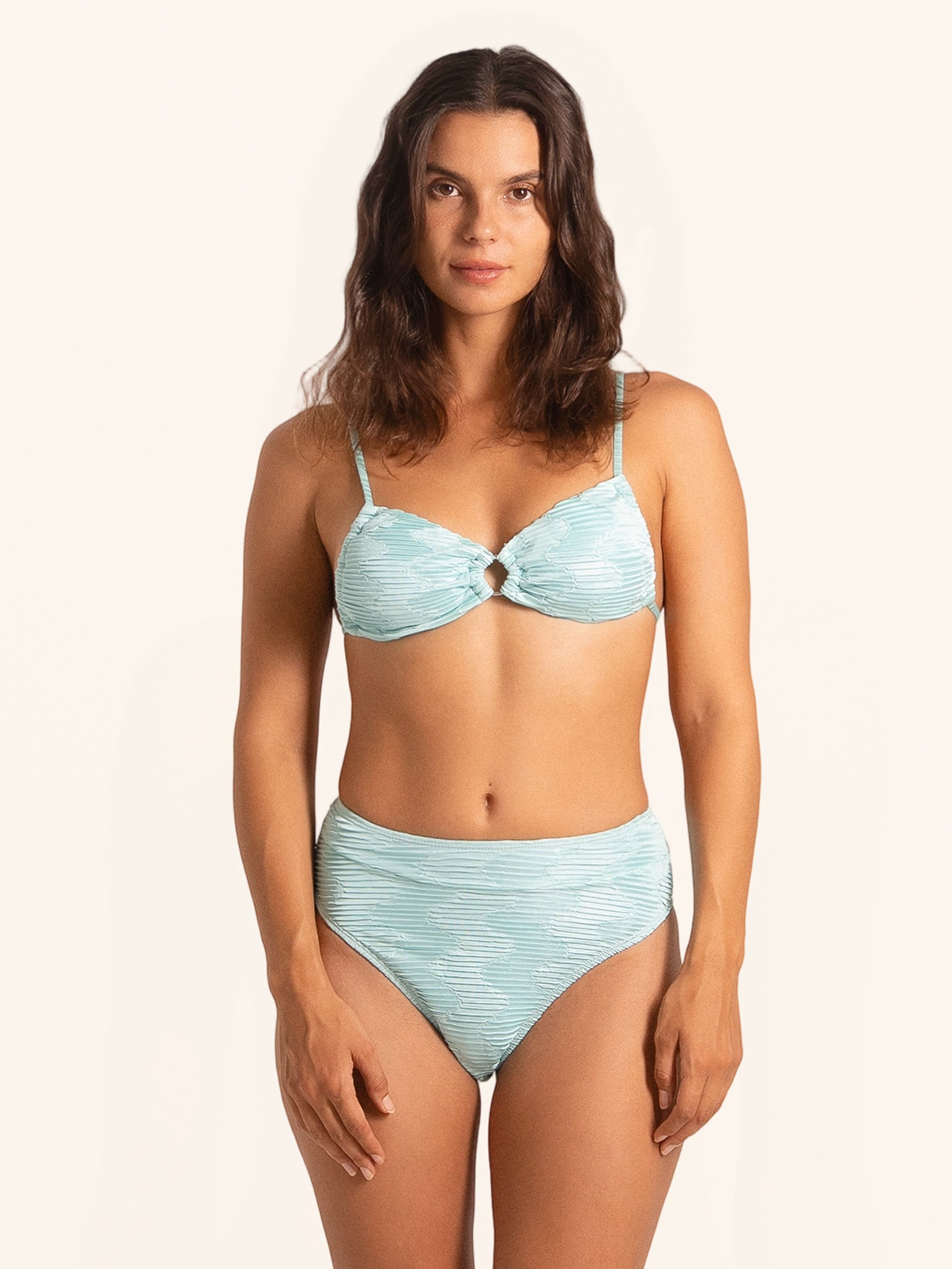 Front view of ice blue high-waisted bikini bottom with textured fabric.