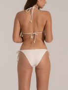 Full back angle of ivory tie-side bikini bottom with clean edge design