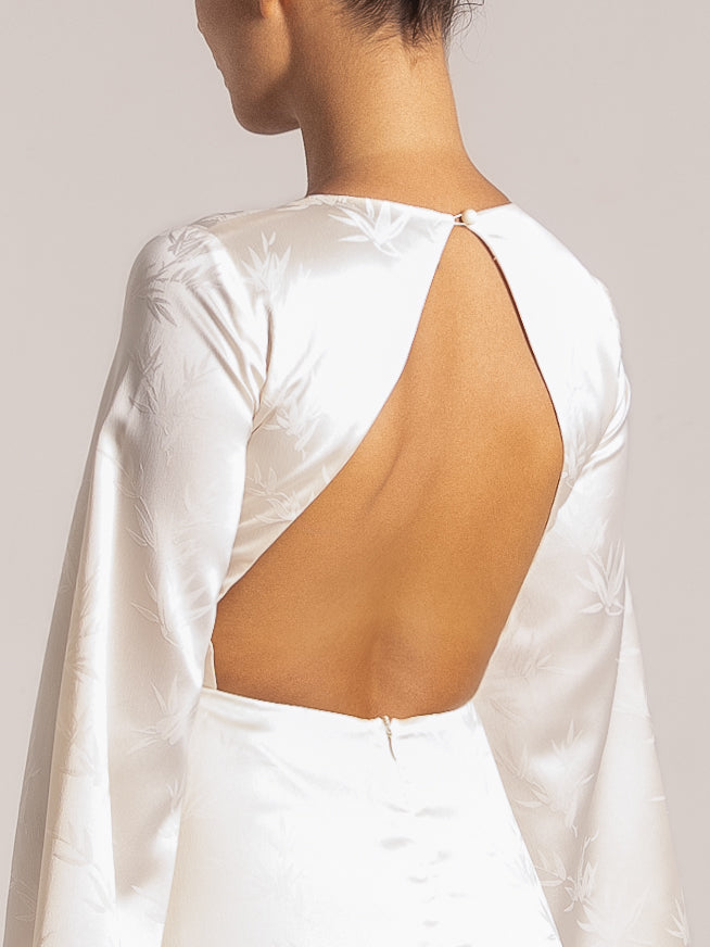 Ivory satin dress with deep V-neck and elegant open-back cutout