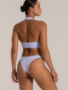 Back view of lavender embroidered halter neck bikini top with wide band support