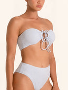 Light blue bandeau bikini top with cutout and front tie detail.