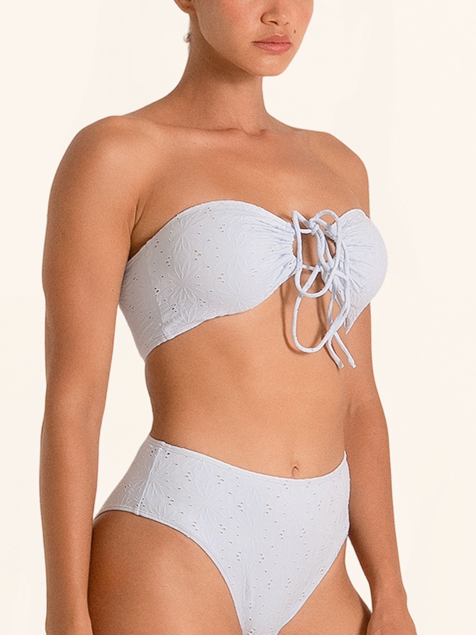 Light blue bandeau bikini top with cutout and front tie detail.