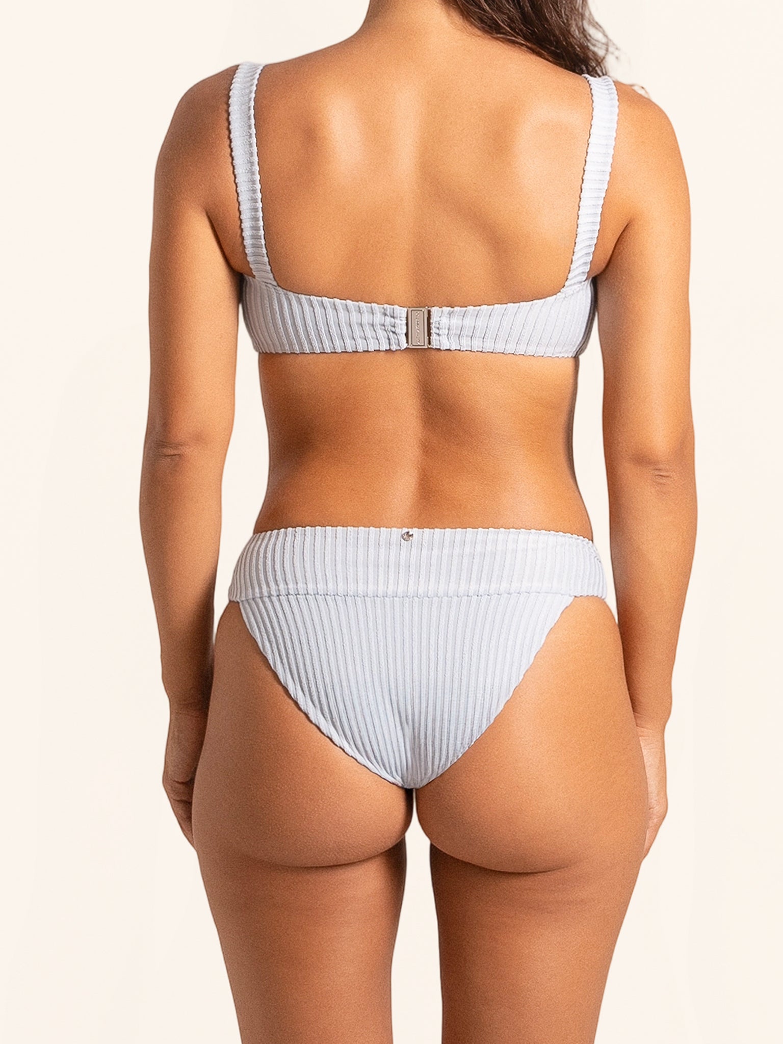 Light blue bikini bottom with striped design and modern fit.