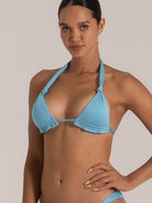 Side view of light blue triangle bikini top with gathered cups and shimmer finish