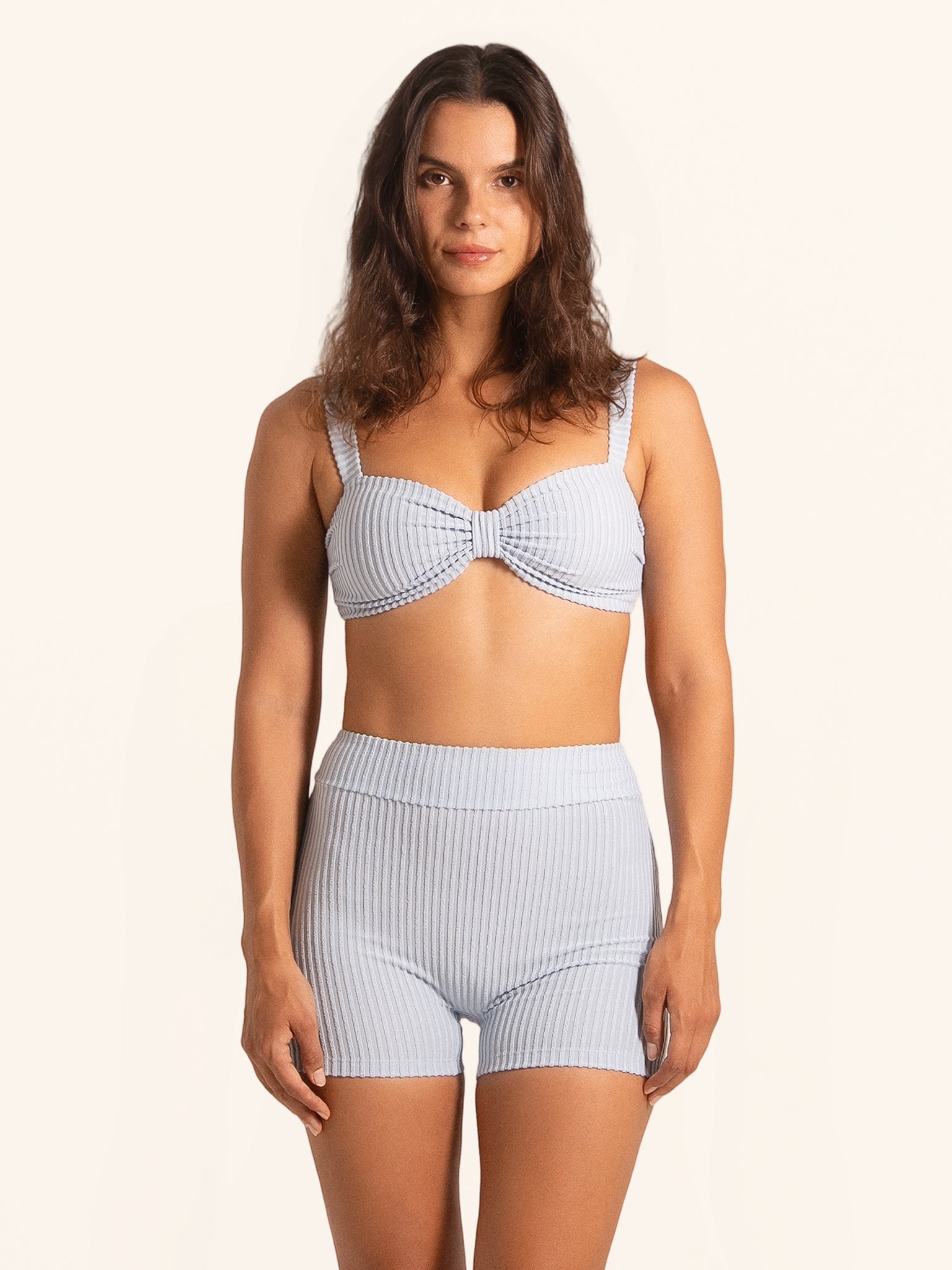 Light blue striped swim shorts with a flattering high waist fit.