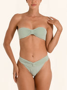 Light green bandeau bikini bottom with flattering high-leg cut.