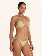 Light green halter bikini top featuring adjustable tie detail.