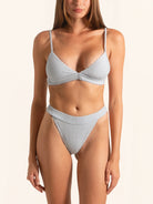 Front view of light grey ribbed bikini bottom with high leg cut and seamless design.