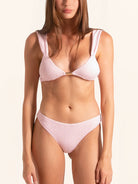 Light pink textured bikini bottom with high leg cut and flattering fit.
