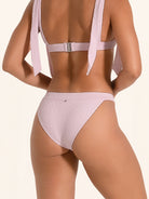 Light pink swim bottom in a minimal coverage style.