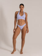 Front view of lilac floral textured bikini set with halter top and cheeky bottom