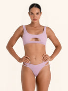 Lilac bikini top with trendy cut-out design.