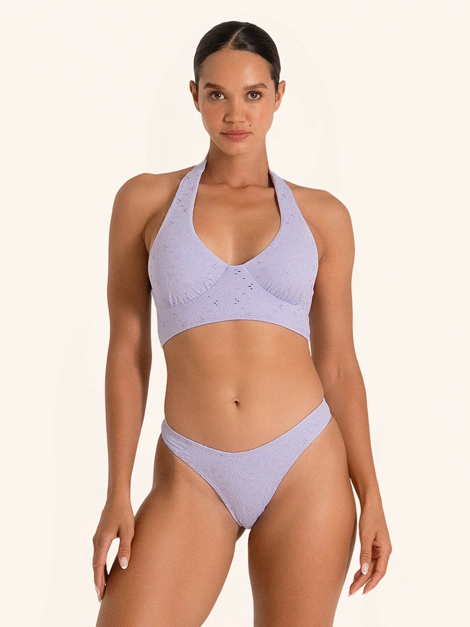 Lilac bikini top with halter neck and cutout detail.