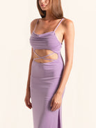Side profile of lilac cut out maxi dress with ruched top and waist cutouts