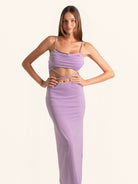 Front view of lilac cut out maxi dress with spaghetti straps and ruched bodice