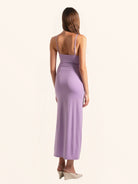Rear side profile of lilac cut out maxi dress with spaghetti straps and sleek hem