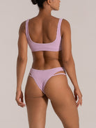 Rear angled view of lilac high-leg bikini bottom with twin side straps