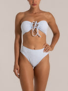 Detailed view of lilac tie-side bikini bottom with textured stretch fabric