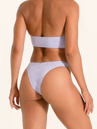 Lilac swimwear bikini bottom with modern cutout detailing.