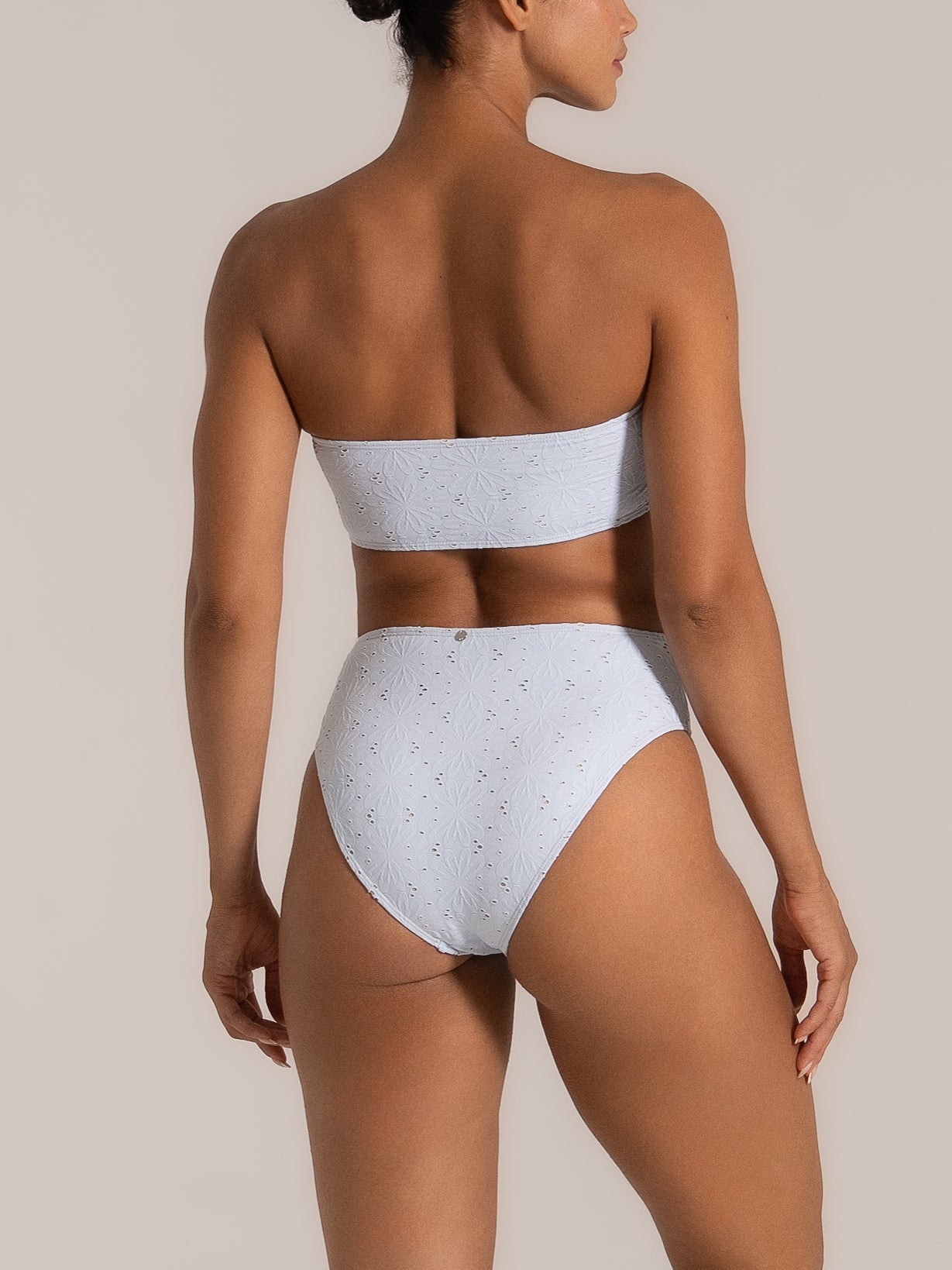 Angled back view of lilac bikini bottom with seamless fit and textured zebra pattern