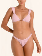 High rise bikini bottom in lilac with sculpting waistband and ribbed details.