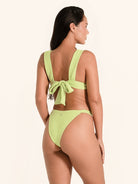 Bold lime green bikini top with thick straps, perfect for summer style.
